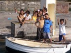 kids on dock by dinghy